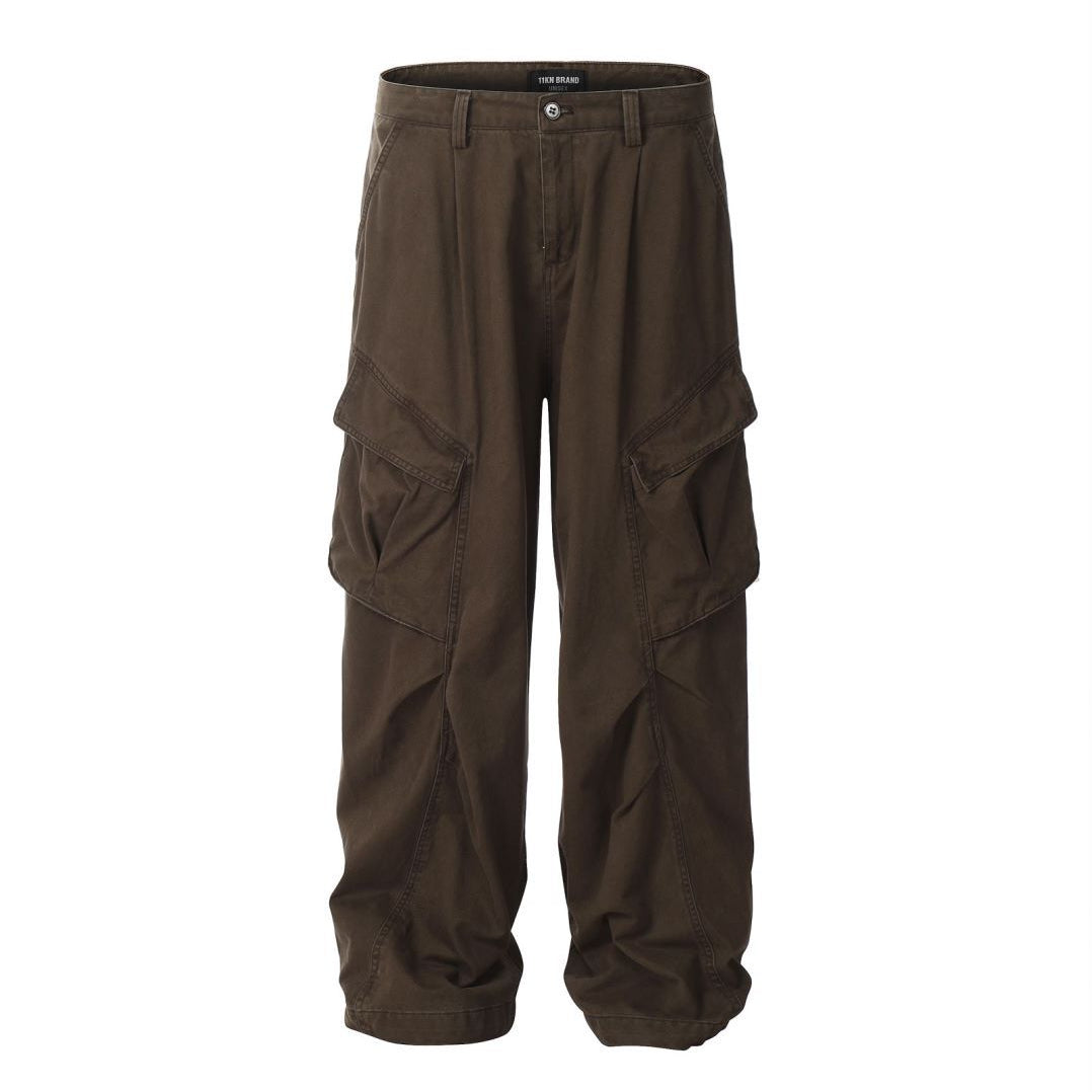 Brown cargo pants by Titan Brand featuring wide-leg design, multiple side pockets, and pleated front detail on white background