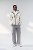 Off-white windbreaker jacket front view on model, hooded shell