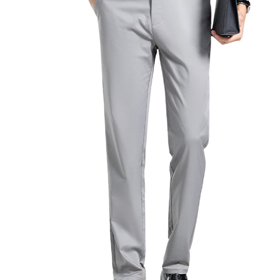 A pair of gray mulberry silk tailored pants with a waistband, held by a person with a white shirt and black shoes.