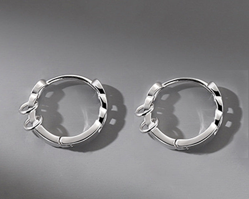 Pair of 12mm copper chain-link hoop earrings on gray background