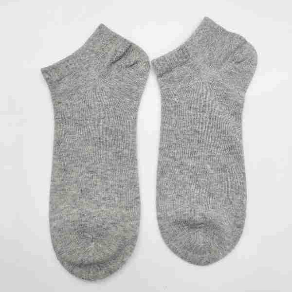 Pair of lightweight heather gray ankle socks with ribbed cuffs on white background