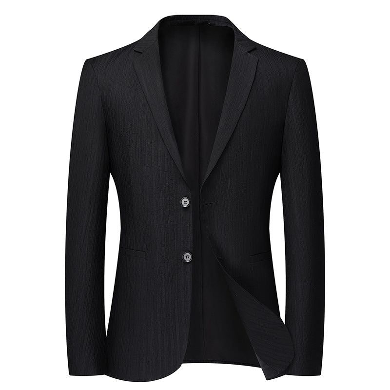 Black single-breasted blazer with textured fabric, notched lapels and two button closure against white background