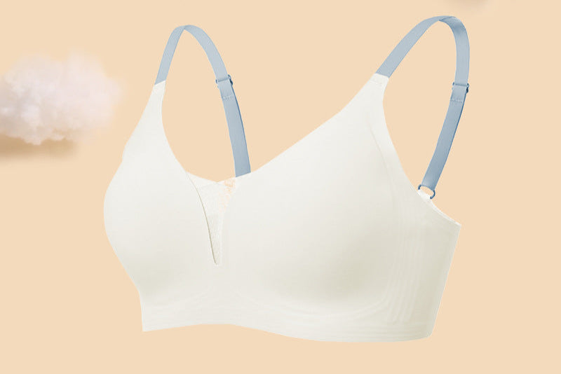 Seamless white wireless bra with soft blue adjustable straps, featuring a deep V-neck and breathable fabric.