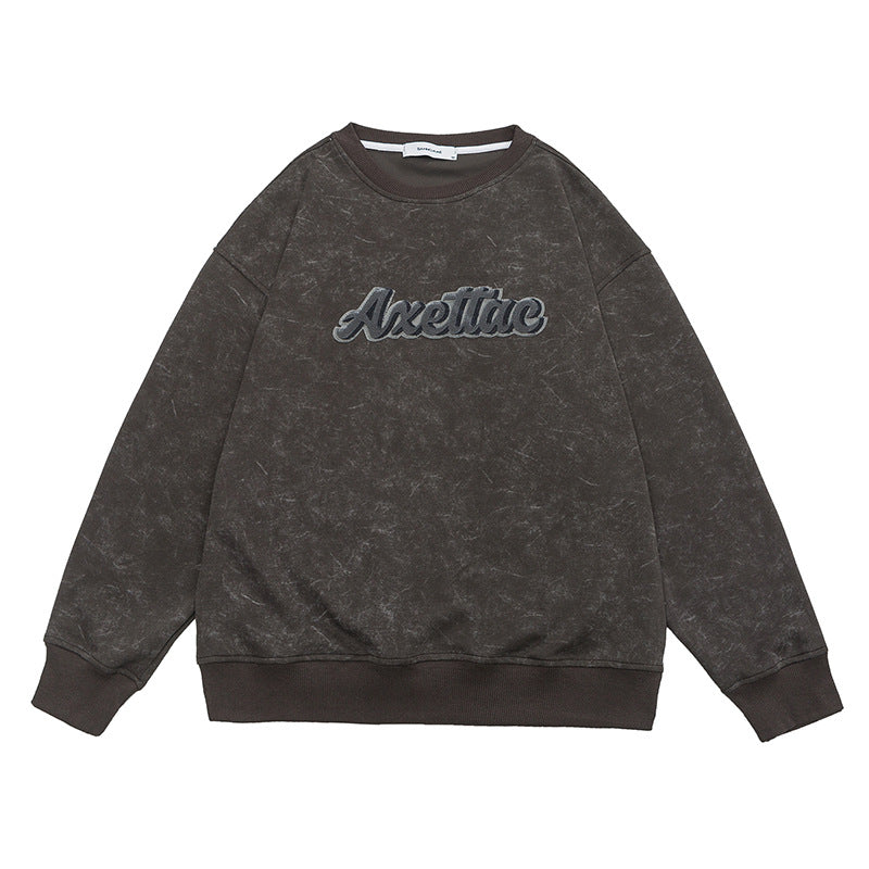 Flat lay of grey Axettac sweatshirt on white background, embroidered logo visible