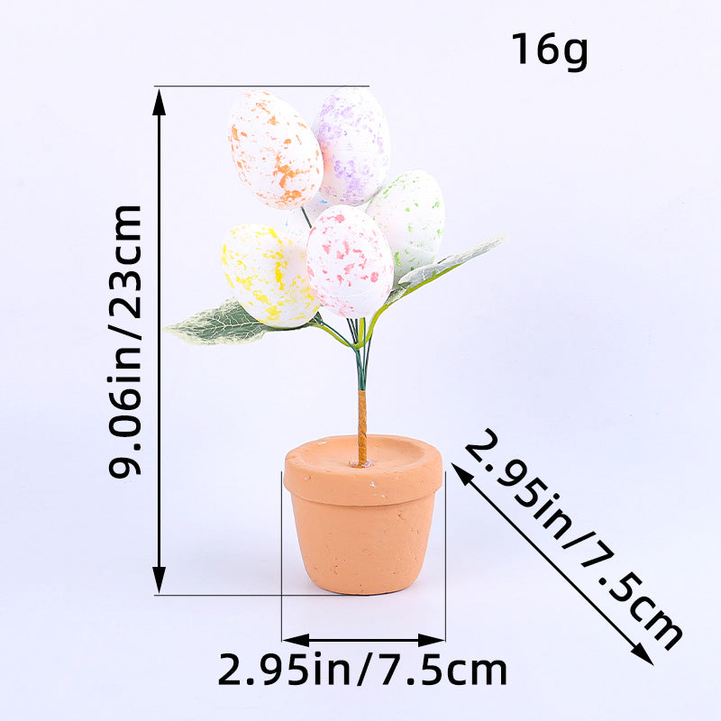 Easter egg tree with pastel eggs and green leaves, measured at 9.06in height and 2.95in pot diameter, on a white background.