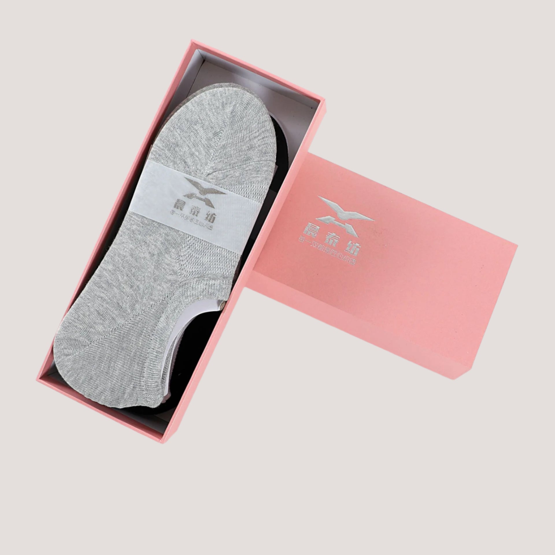 Premium no-show socks in gift box, featuring gray knit design with brand logo and packaging in pink with silver brand emblem