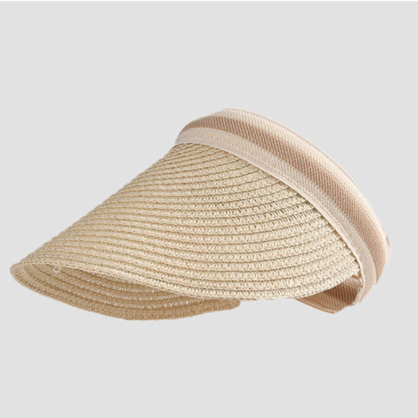 A classic beige straw visor with a beige band, offering a lightweight and airy design for sunny days.