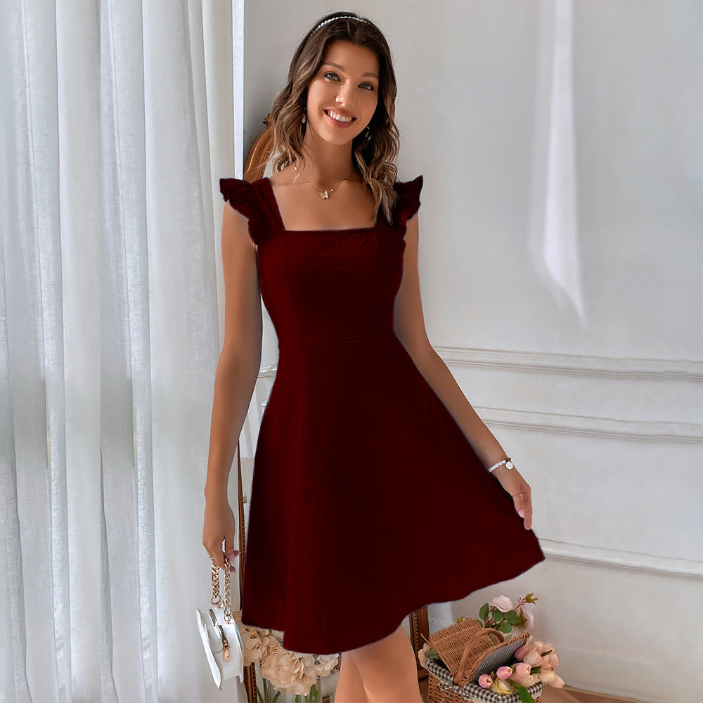 Burgundy A-line dress with ruffle straps and square neckline, styled with crystal headband
