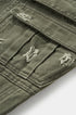 Army green cargo pants distressed pocket stitching close-up