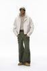 Army green cargo pants on model casual front pose, mid-rise