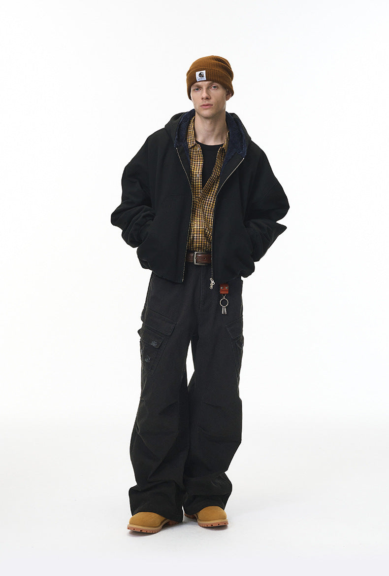 Black cargo pants full body on model with jacket, relaxed street fit