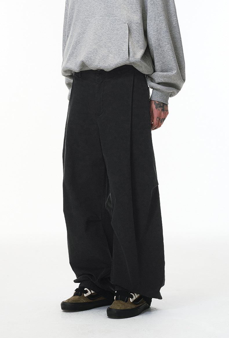 Black corduroy pants back view on model, elastic waist and relaxed fit