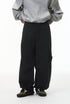 Black corduroy pants side view on model, wide leg with straight cuff
