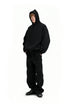 Black oversized hoodie side view on model, drop shoulder fit