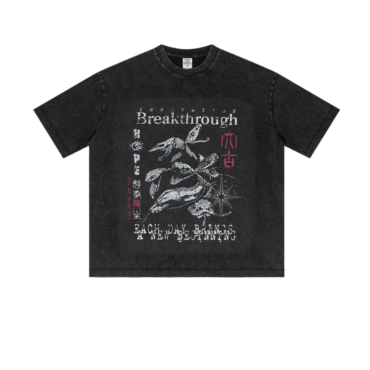 Flat lay of vintage black "Breakthrough" tee with koi fish and compass graphic.