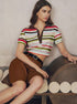Woman sitting down in striped crop polo top and brown shorts