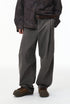 Charcoal corduroy pants front view on model, wide leg with straight cuff
