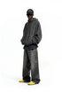 Charcoal oversized hoodie side view on model, rib cuffs