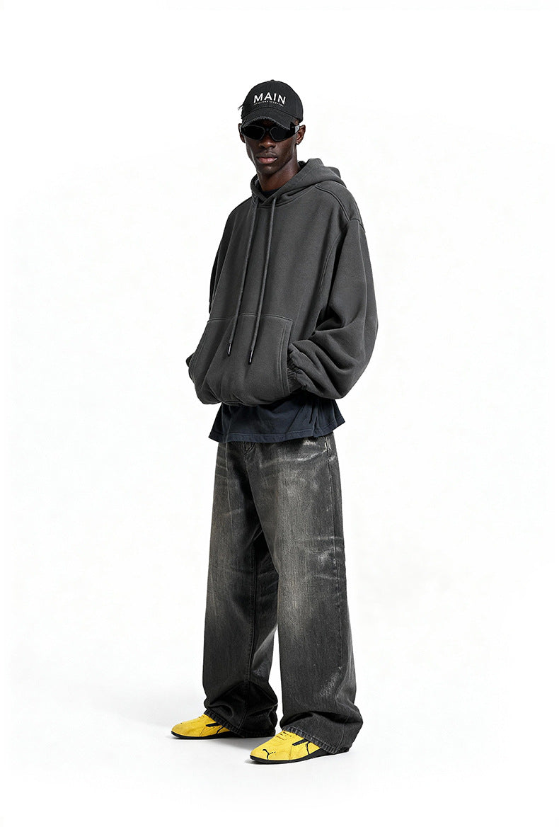 Charcoal oversized hoodie side view on model, rib cuffs