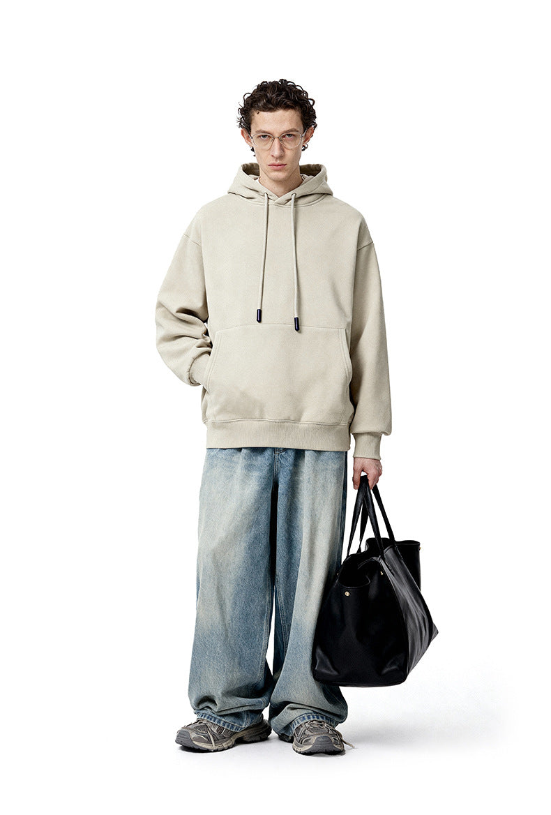 Cream oversized hoodie front view on model, relaxed street fit