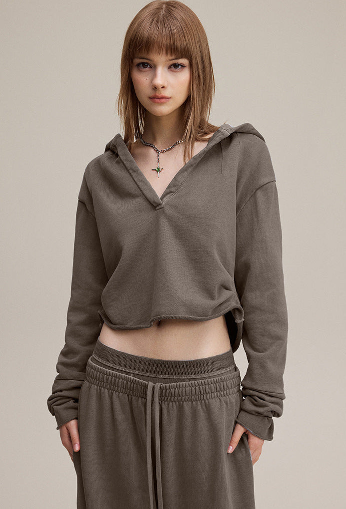 Brown cropped hoodie, front view—boxy crop, clean lines.