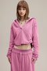 Rose pink cropped hoodie,front view—relaxed fit with raw hem.