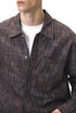 Dark-brown plaid shirt chest and collar close-up, button front