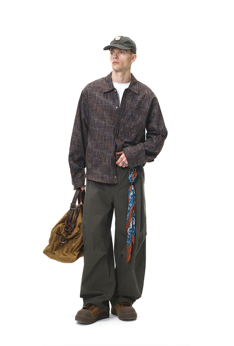 Dark-brown plaid shirt full-body with bag, angled stance
