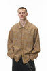 Dark-brown plaid shirt close-up at waist, pocket and hem