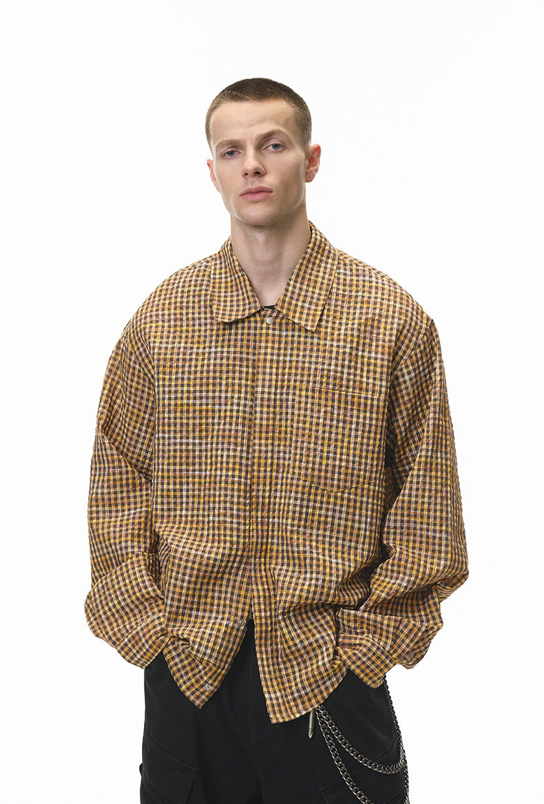 Dark-brown plaid shirt close-up at waist, pocket and hem