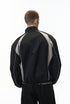 Black racing jacket back view, curved contrast panels, elastic hem
