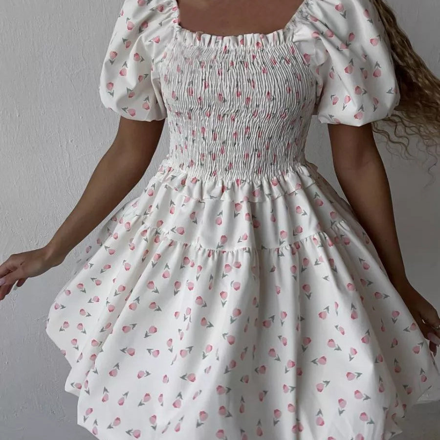Close-up of smocked bodice on rose print mini dress
