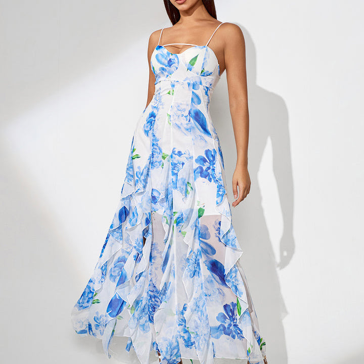 Woman wearing a blue floral slit dress on a white background