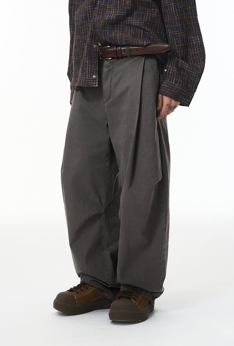 Charcoal corduroy pants side view, relaxed drape and roomy leg