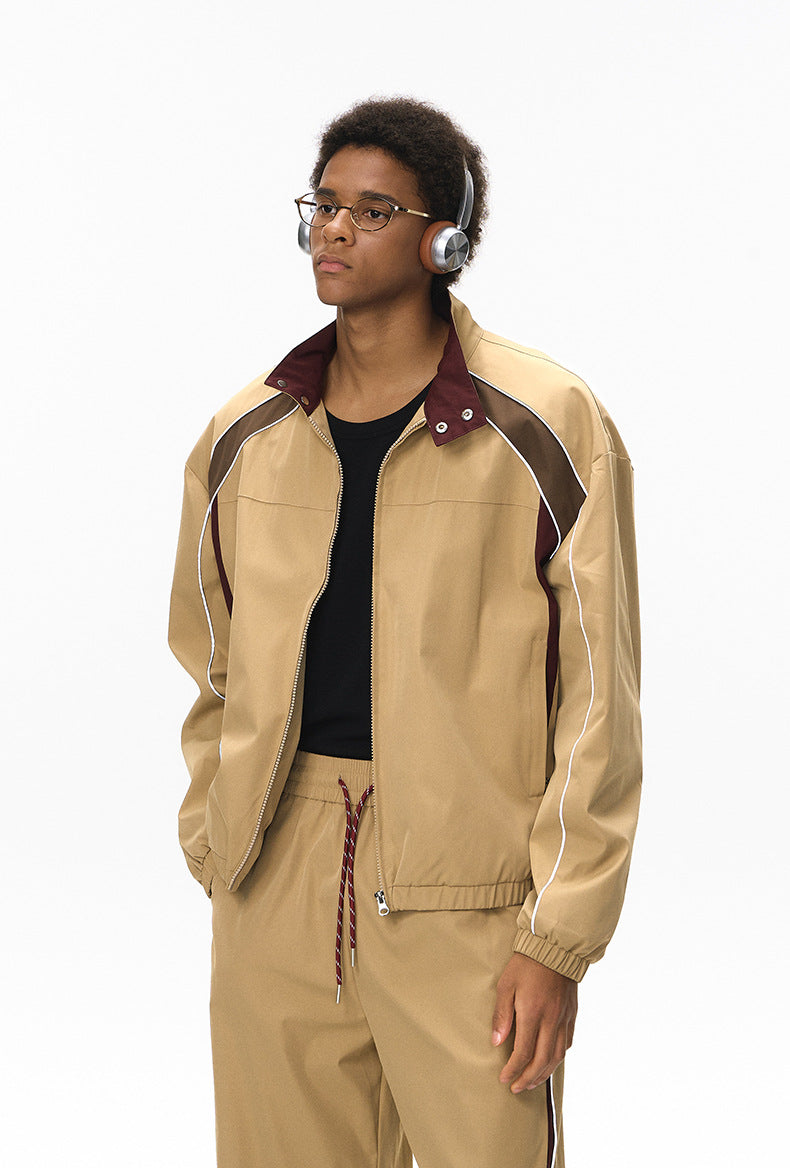 Khaki racing jacket half-body, zip open showing contrast lining