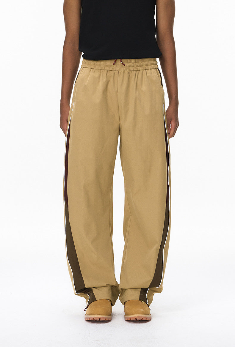 Khaki wide leg track pants front view, elastic waist and straight hem