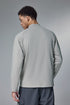 Back view of a light gray half-zip long sleeve tshirt on a gray background