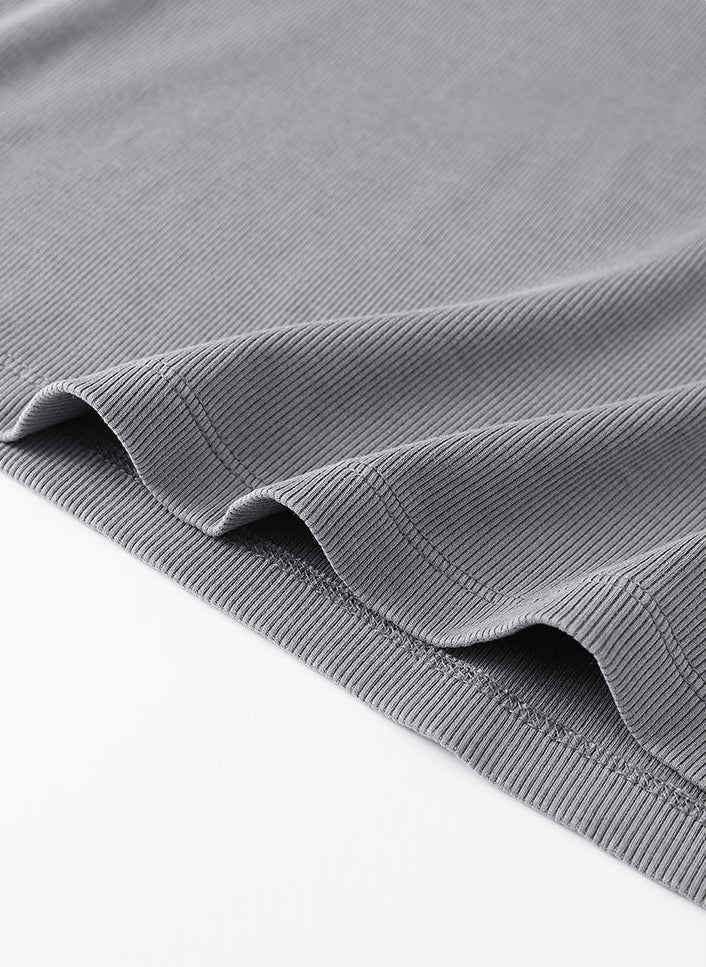Ribbed hem detail of light gray women’s long sleeve tee