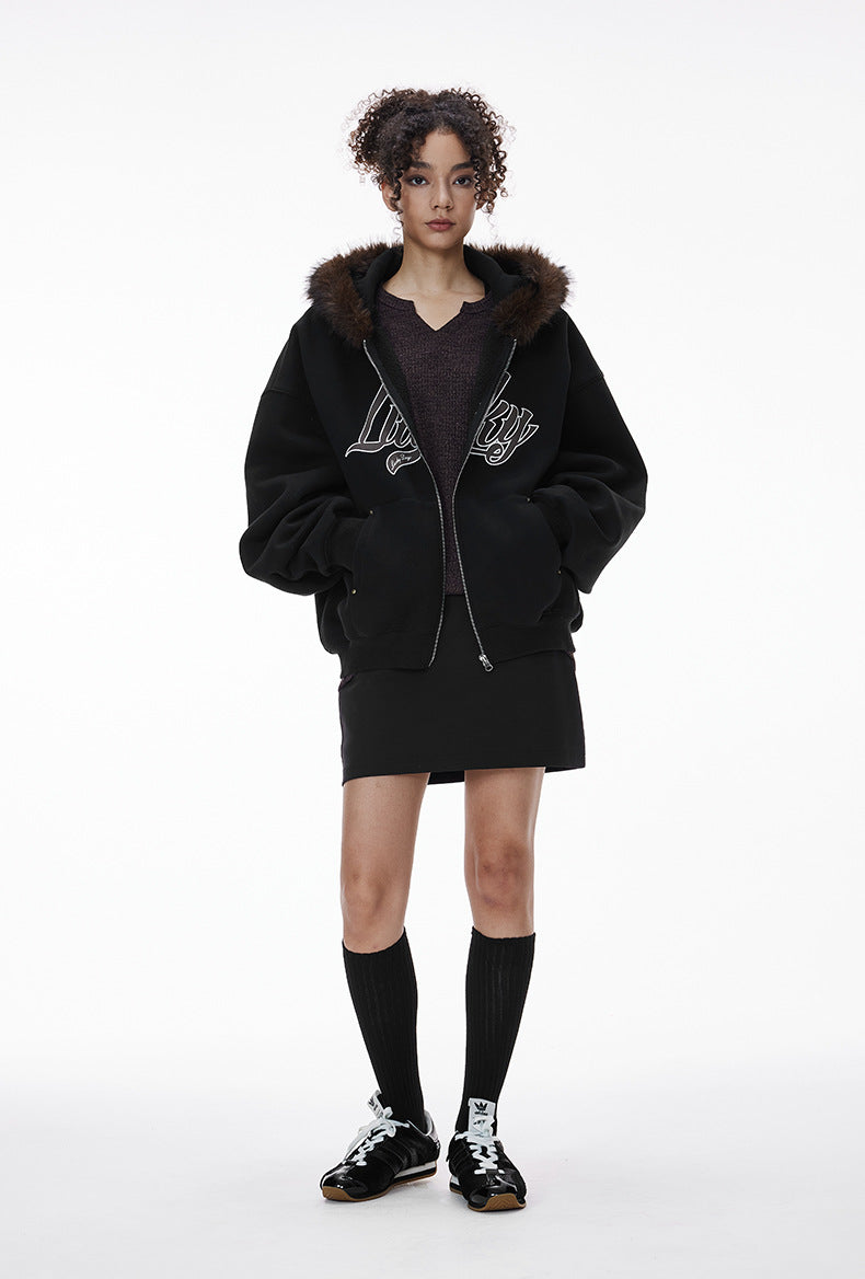 Female model in black fur-hood zip jacket, full body front.