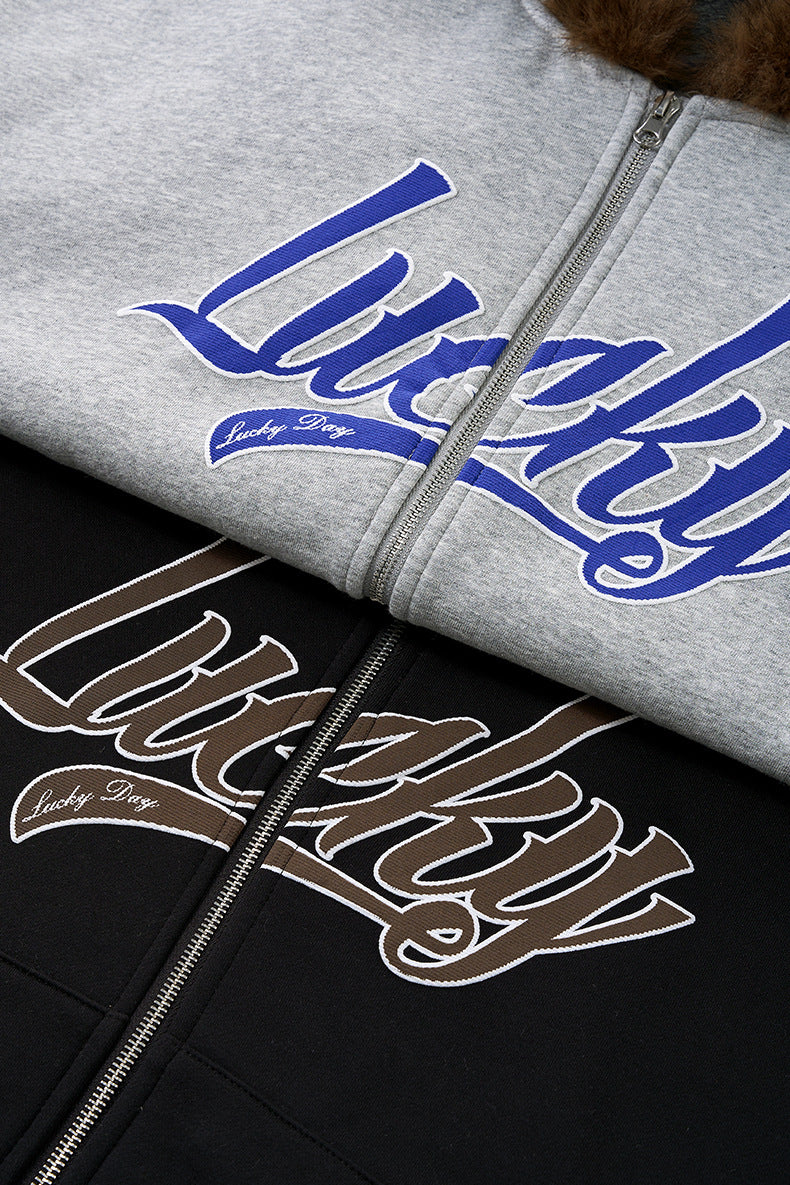 Split detail—black logo embroidery and gray blue “Lucky” print.