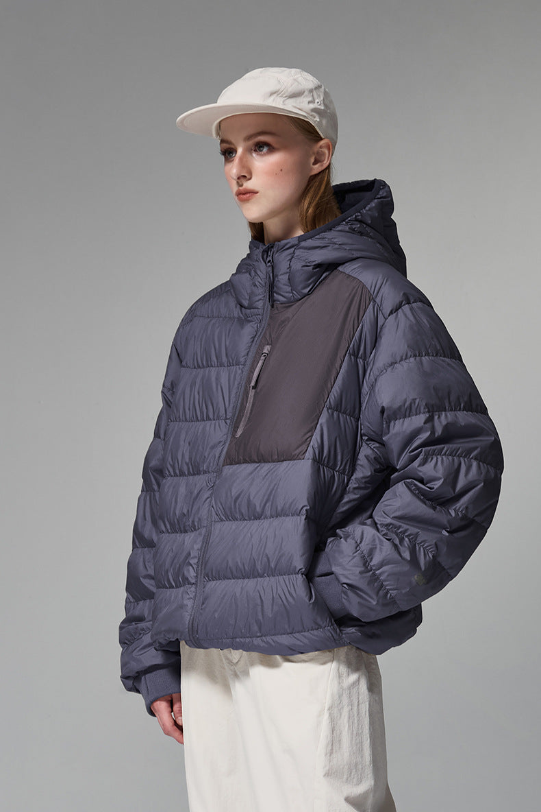 Navy blue men’s puffer jacket side profile with hand pockets