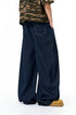 Dark blue wide leg jeans side view, long straight cuff