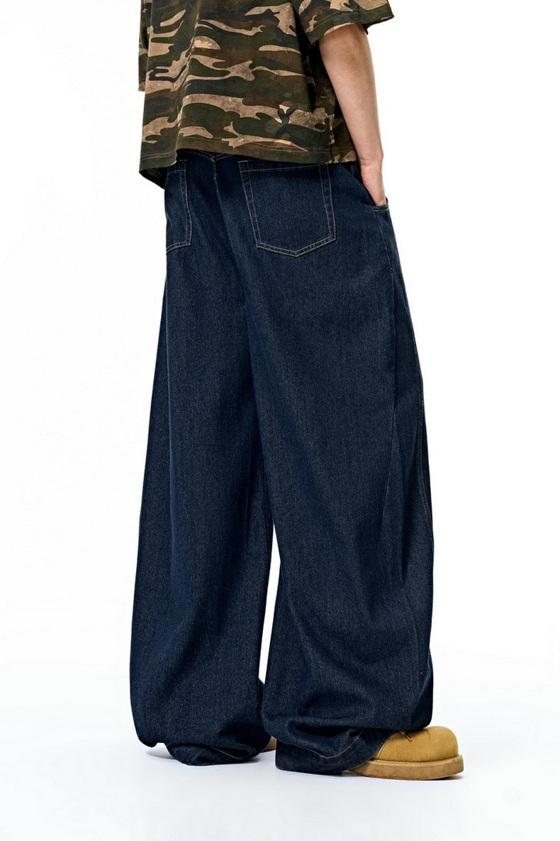 Dark blue wide leg jeans side view, long straight cuff
