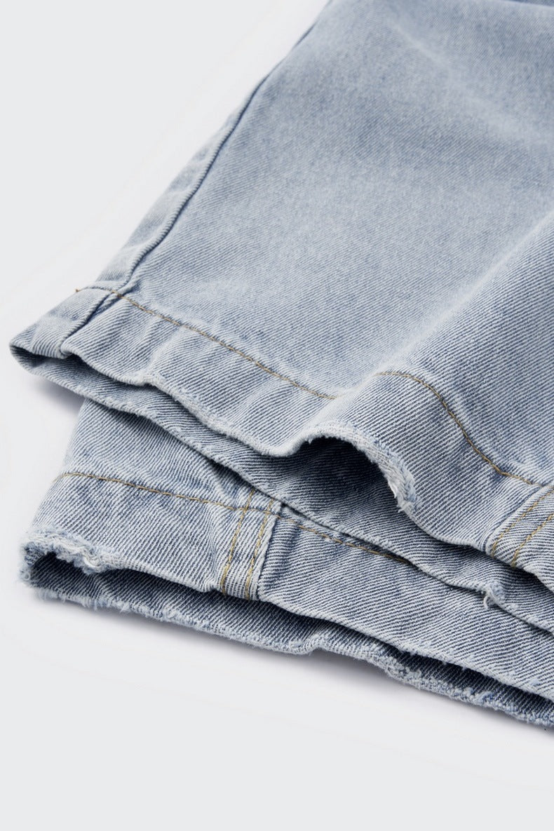 Light blue wide leg jeans detail, soft washed denim texture