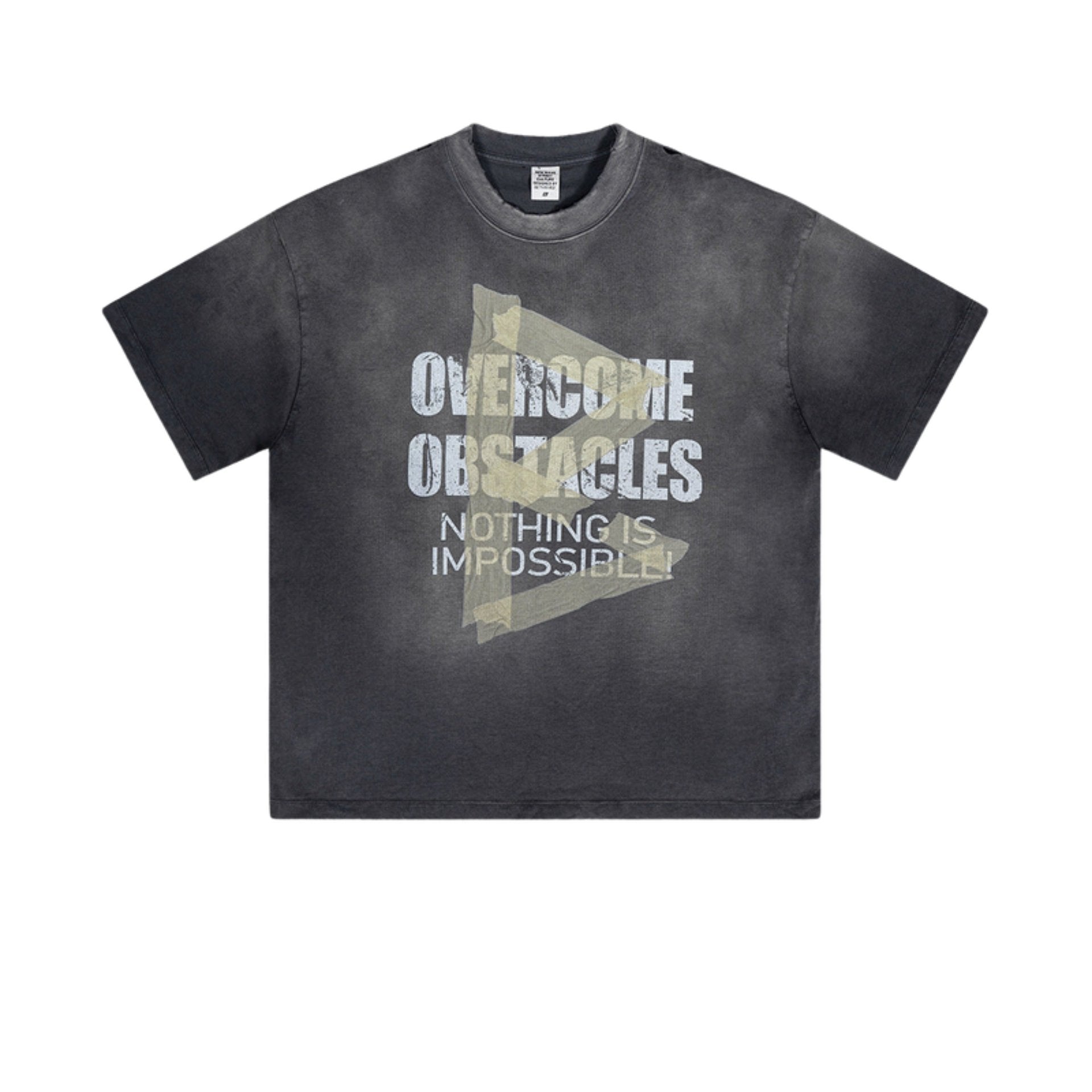 Flat lay of black graphic tee with 'Overcome Obstacles' text and taped triangle graphic.