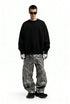 Men’s oversized sweatshirt black on model, wide stance front view