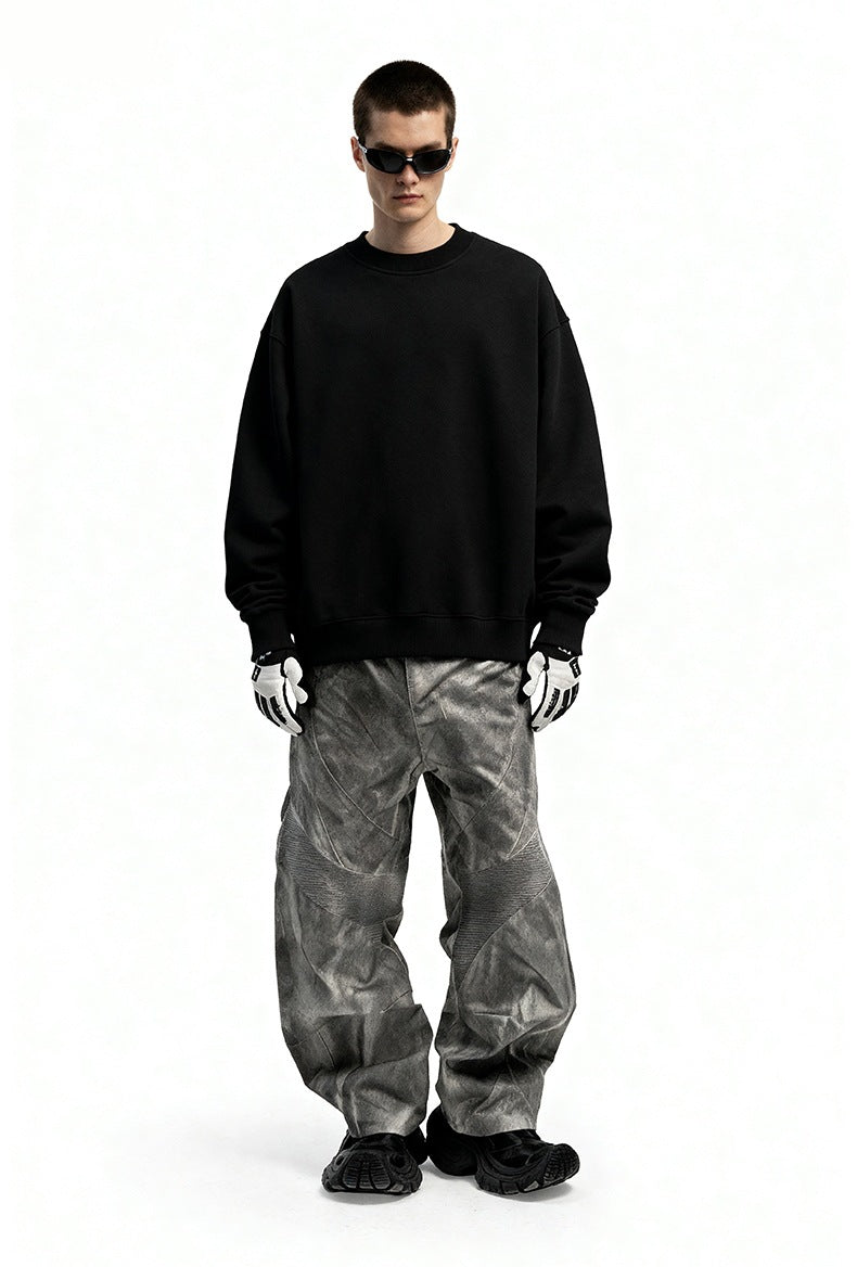 Men’s oversized sweatshirt black on model, wide stance front view