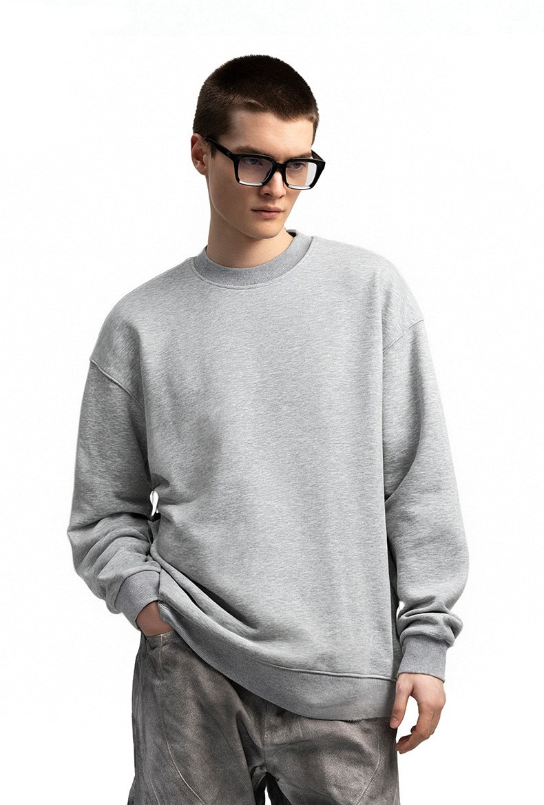 Men’s oversized sweatshirt light gray on model, half-body front