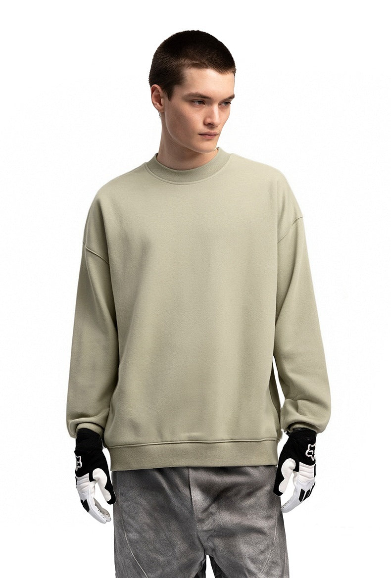 Men’s oversized sweatshirt light khaki on model, half-body front