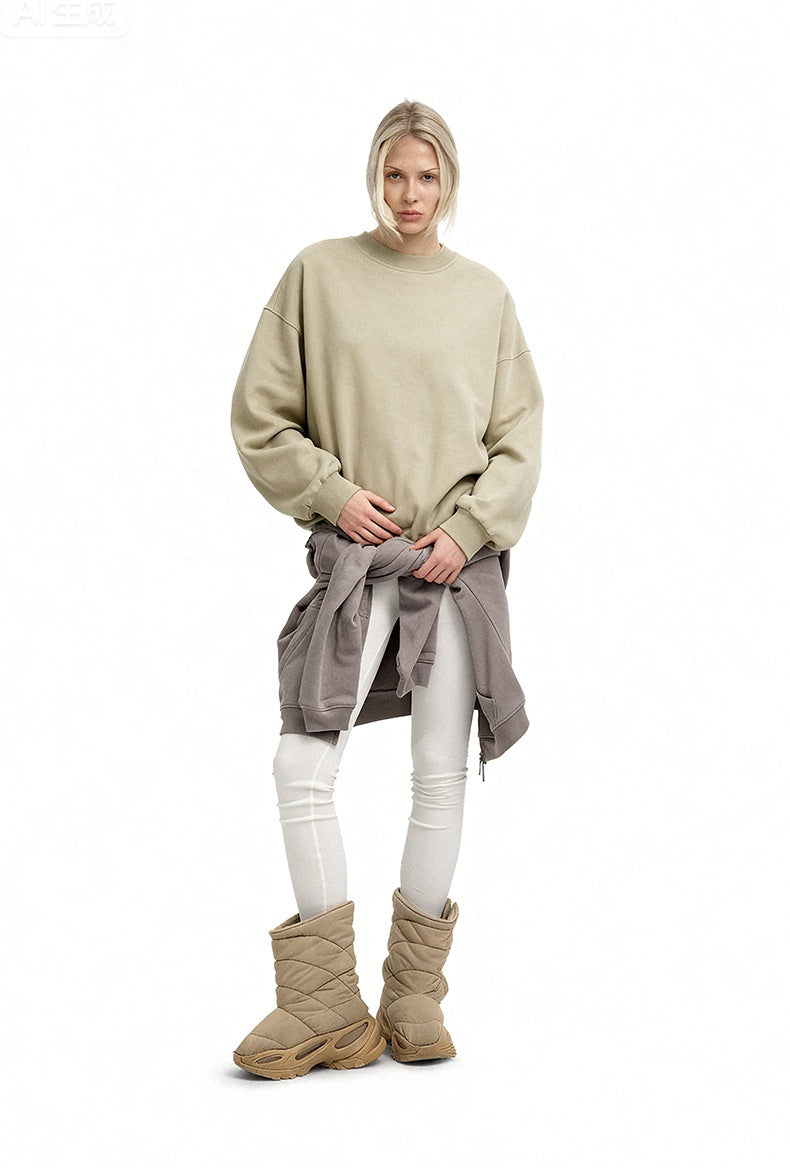 Women’s oversized sweatshirt light khaki styled with boots and tied layer